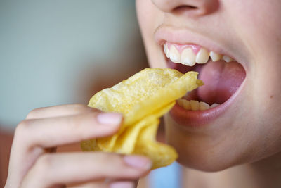 Close-up of woman holding fruit