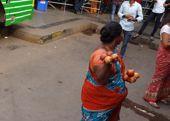 High angle view of people standing on street