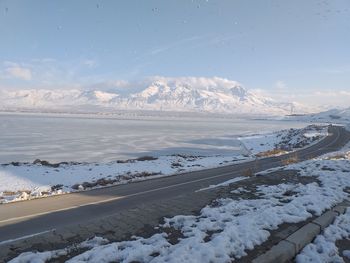 Scenic view of snow covered mountains against sky