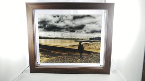 Scenic view of sea against sky seen through window