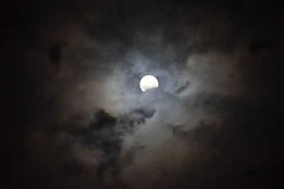 Low angle view of moon against sky at night