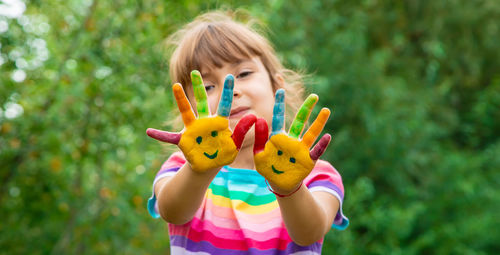 Girl showing painted hands