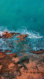 Aerial view of rock formation in sea