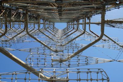 Low angle view of metal structure against sky