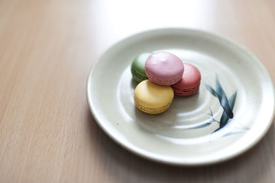 Close-up of macaroons in plate on table