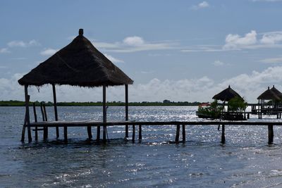 Built structure on beach against sky