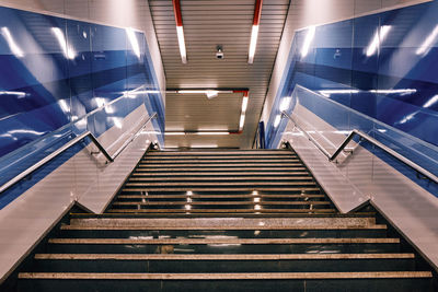 Low angle view of escalator in illuminated building