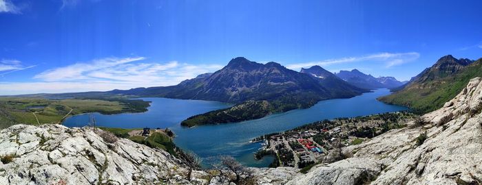 Panoramic view of sea and mountains against sky