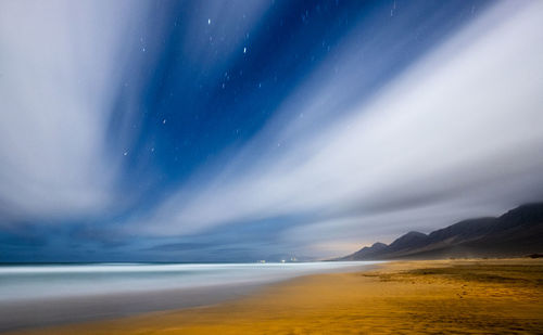 Scenic view of sea against sky at night