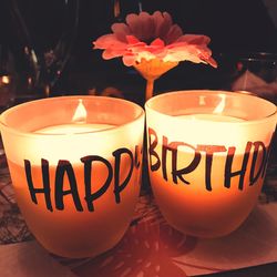 Close-up of lit candles on table