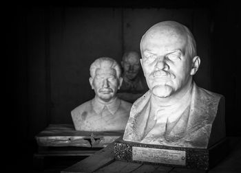 Statue of man sitting on table