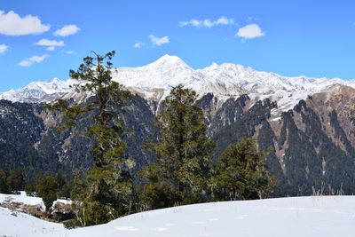 Scenic view of snowcapped mountains against sky