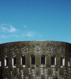 Low angle view of building against clear blue sky