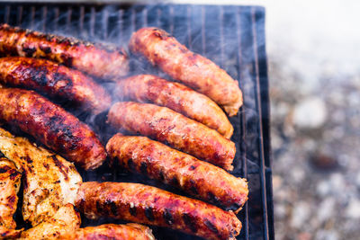 High angle view of meat on barbecue grill