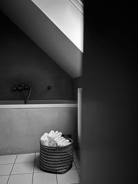 Basket with towels in bathroom in penumbra 