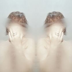 Close-up of woman over white background