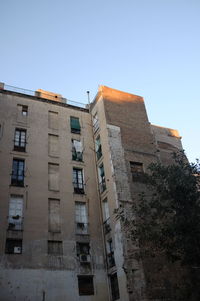 Low angle view of old building against clear sky