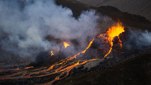 Smoke emitting from volcanic mountain at night