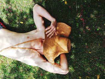 High angle view of woman lying on field