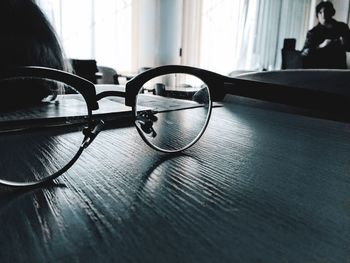 Close-up of eyeglasses on table