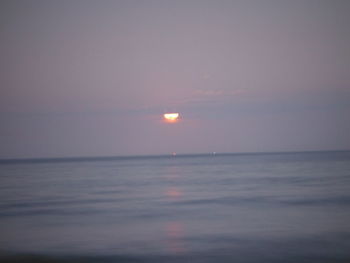 Scenic view of sea against sky at sunset