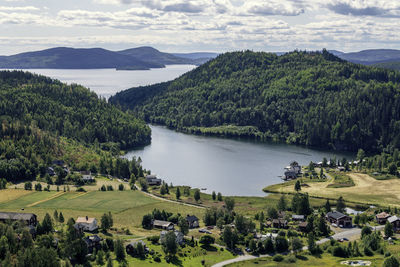 High angle view of lake and trees against sky