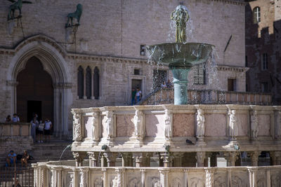 Fountain in front of historic building