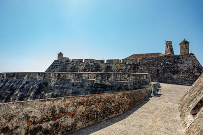 Low angle view of fort against clear sky