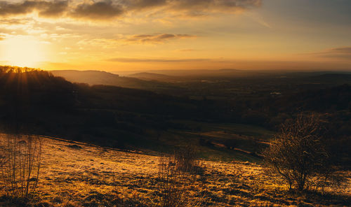 Scenic view of landscape against sky during sunset