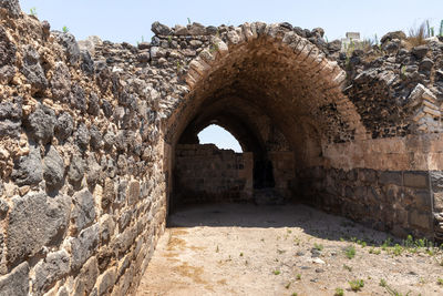 Archway of historic building against sky