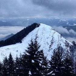 Scenic view of snow covered mountains against sky