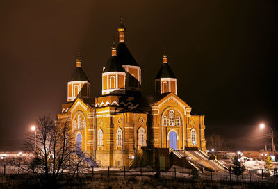 Church against sky at night