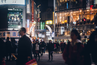 Crowd in city at night