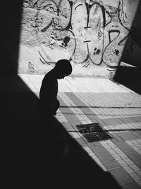 Shadow of woman on wall