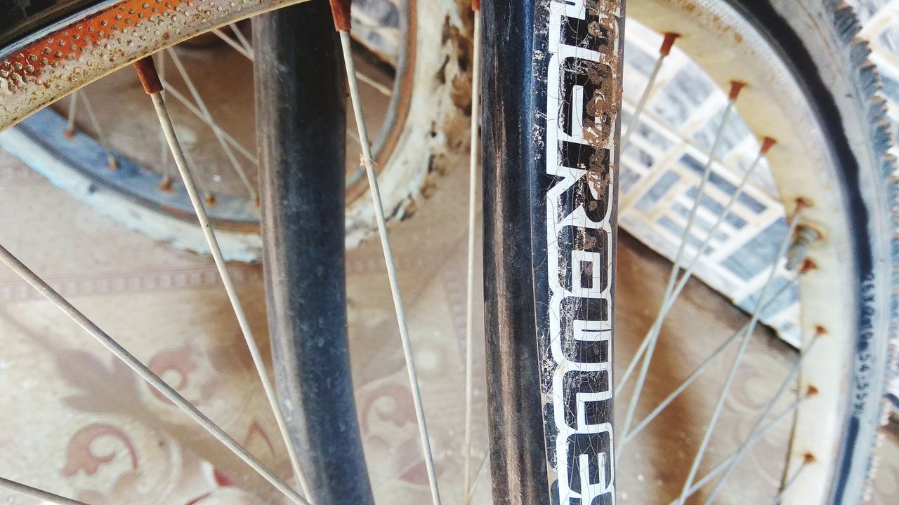 CLOSE-UP OF OLD BICYCLE WITH METAL