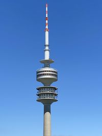 Low angle view of communications tower against sky