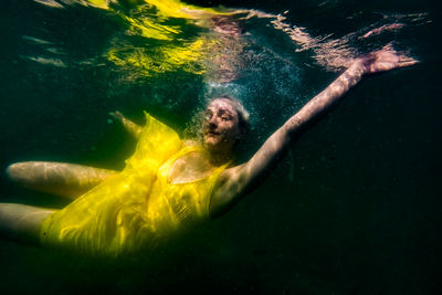 Young woman swimming in sea