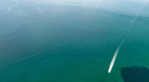 High angle view of sea against blue sky