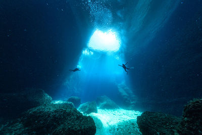 People swimming in sea