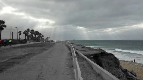 Scenic view of sea against cloudy sky