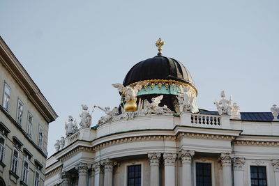 Low angle view of hofburg against sky in city