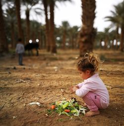 Girl looking at tree