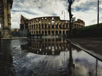 Reflection of buildings in puddle