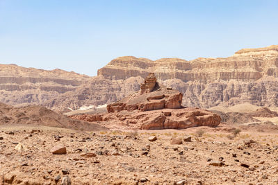 Rock formations in desert against sky