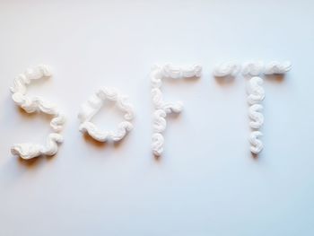 High angle view of bread on white background