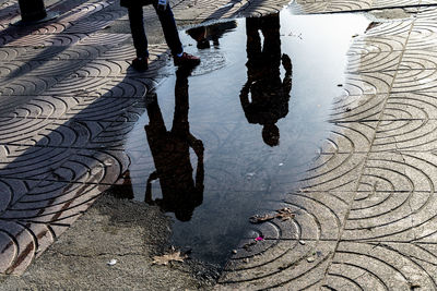 Low section of people on wet street