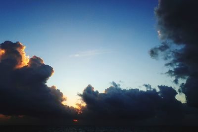 Low angle view of sea against sky during sunset