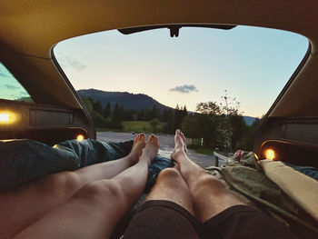 Low section of man driving car