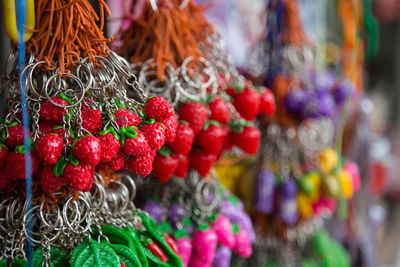 Strawberry shape key rings hanging at market for sale