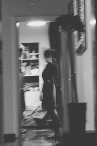 Full length of woman standing on bench